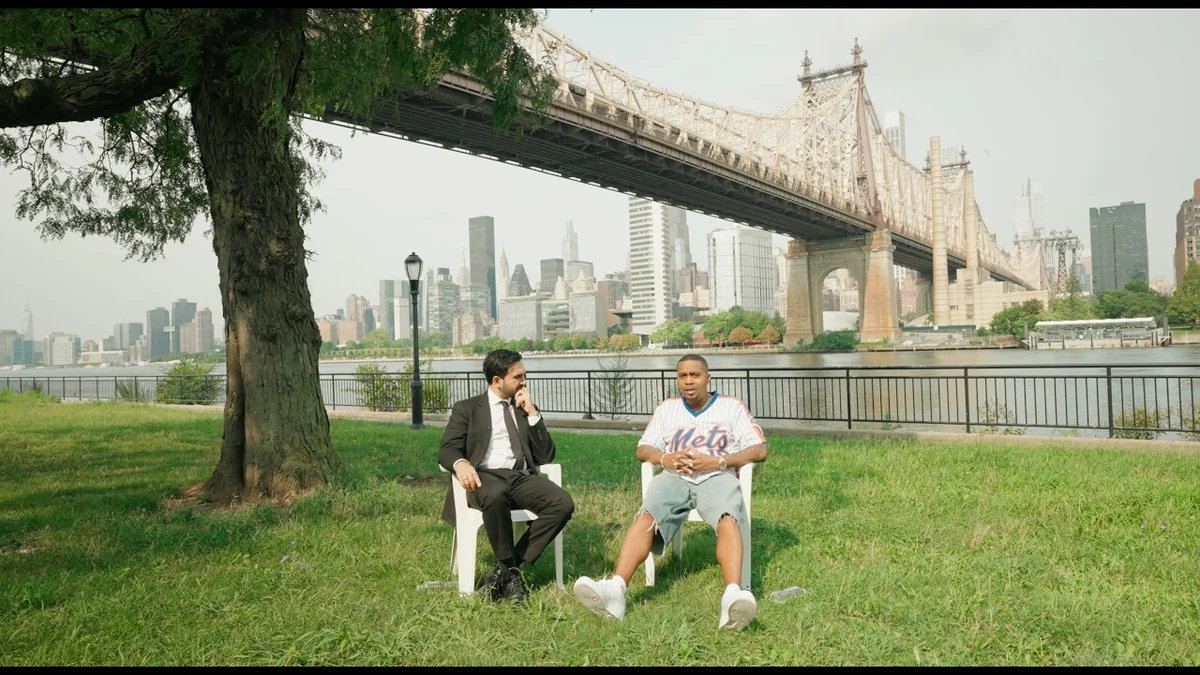 Wide shot of the Queensbridge park waterfront with the Manhattan skyline where the Nas and Mamdani conversation was filmed
