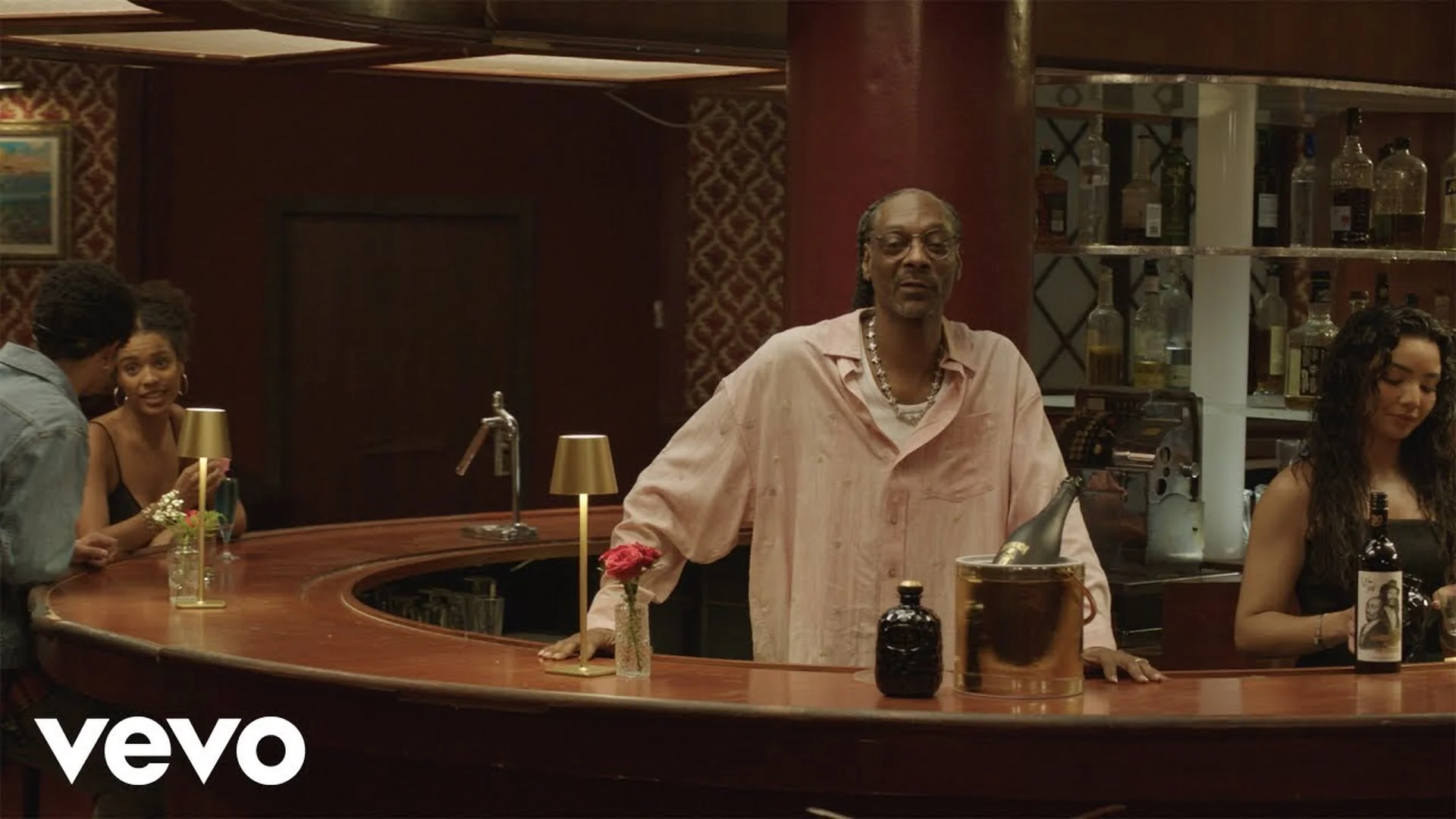 Snoop Dogg behind a dim lounge bar in The Vent, the Death Row Records short film he directed